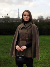 a lady wears a coffee brown wool cloak and vest